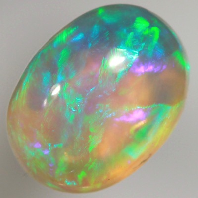 SOLID CRYSTAL OPAL Rolling flashes of green and turquoise with a purple hue